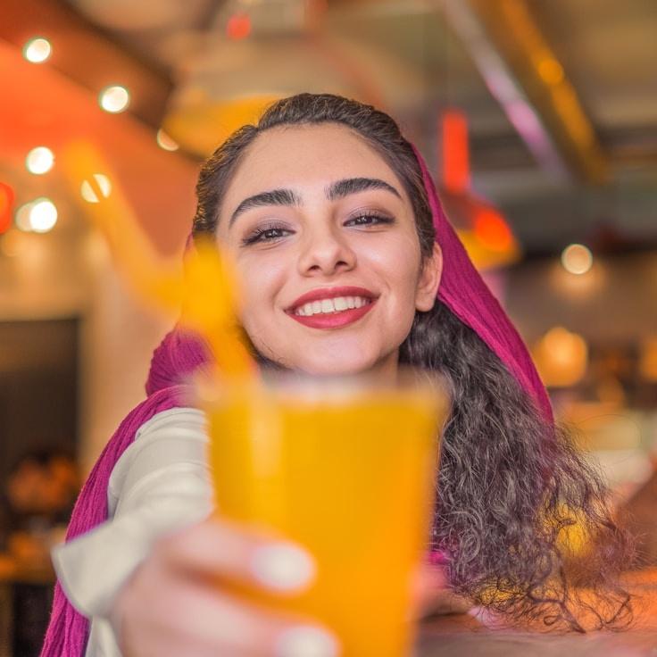 Lena Kapoor, Lead Design Curator at Basic Logic Summit, reviewing corporate floral arrangements